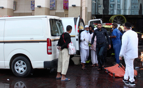Emergency personnel wait to evacuate injured people after a fire broke out in a hotel, in Medina February 8, 2014. Fifteen people died and around 130 were injured when a fire broke out in a hotel packed with Muslim pilgrims in the Saudi Arabian city of Medina on Saturday, the state news agency said. (REUTERS)