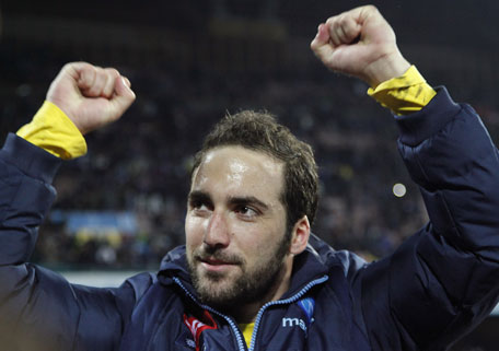 Napoli's Gonzalo Higuain celebrates after winning the Italian Cup semifinal second leg football match against AS Roma at the San Paolo Stadium in Naples, on February 12, 2014. (AFP)