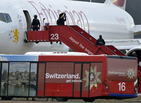 Police evacuate passengers from the Ethiopian Airlines flight en route to Rome, which was on hijacked and forced to land in Geneva, where the hijacker has been arrested, police said. There were no immediate reports of injuries and in a statement in Addis Ababa Ethiopian Airlines said "the passengers are safe and sound." According to the ATS news agency, the flight was carrying some 200 people and was hijacked as it flew over Sudan, but the reason for the hijacking was not immediately clear. (AFP)