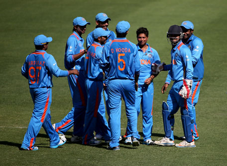 Kuldeep Yadav of India celebrates with teammates during the ICC U19 Cricket World Cup 2014 match between India and Scotland at the Dubai International Stadium on February 17, 2014 in Dubai, UAE. (IDI/GETTY)