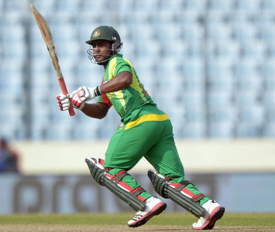 Imrul Kayes hits a shot during the Asia Cup match between Bangladesh and Pakistan in Mirpur on Tuesday March 4. (AFP)