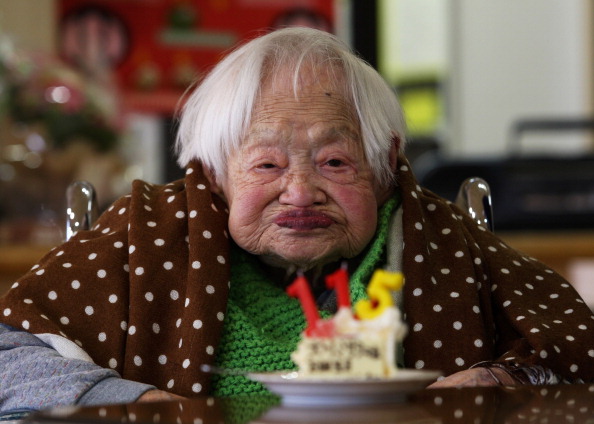 Misao Okawa, who is recognised by Guinness World Records as the world's oldest woman, receives a birthday cake during her 115th birthday celebrations at Kurenai Nursing Home on March 5, 2013 in Osaka, Japan. Misao Okawa, was born in Tenma, Osaka, on March 5, 1898. A descendent of Kimono merchants, she married in 1919 and had three children, of which a daughter and a son are still alive, and four grandchildren and six great-grandchildren. (Photo by Getty Images)