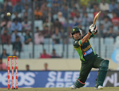 Pakistan batsman Umar Akmal plays a shot during the final match of the Asia Cup one-day cricket tournament at the Sher-e-Bangla National Cricket Stadium in Dhaka on March 8, 2014. (AFP)