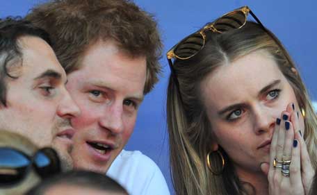 Britain's Prince Harry (2-L) and British socialite Cressida Bonas (R) watch the match during the Six Nations International rugby Union match between England and Wales at Twickenham, West London on March 9, 2014. (AFP)