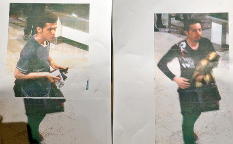 A Malaysian police official displays photographs of the two men who boarded the Malaysia Airlines MH370 flight using stolen European passports to the media at a hotel near Kuala Lumpur International Airport in Sepang on March 11, 2014. Malaysian police said on March 11 one of two suspect passengers who boarded a missing passenger jet was an Iranian illegal immigrant, as relatives of some of the 239 people on board said they were losing hope for a miracle. (AFP)