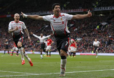 Liverpool's Luis Suarez celebrates his goal against Manchester United during their English Premier League soccer match at Old Trafford in Manchester, England, March 16, 2014. (REUTERS)