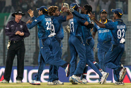 Sri Lanka players celebrate their win over South Africa by 5 runs at the end of their ICC Twenty20 Cricket World Cup match in Chittagong, Bangladesh, Saturday, March 22, 2014. (AP)