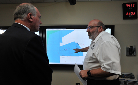 Mike Barton, rescue coordination chief, right, shows Australia's Deputy Prime Minister, Warren Truss, the map of the Indian Ocean search areas at the rescue coordination center of Australian Maritime Safety Authority in Canberra, Sunday, March 23, 2014. Planes and ships scrambled Sunday to find a pallet and other debris in a remote patch of the southern Indian Ocean to determine whether the objects were from the Malaysia Airlines jet that has been missing for more than two weeks. (AP)