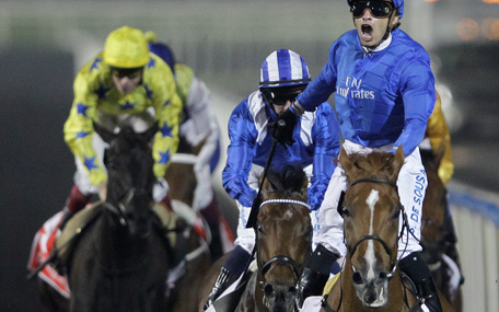 African Story from Great Britain, front right, ridden by Silvestre De Sousa, crosses the finish line to win the world's richest horse race Dubai World Cup at Meydan racecourse in Dubai, United Arab Emirates, Saturday, March 29, 2014. (AP)