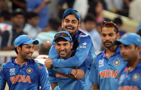 Indian players celebrate after winning the match against Australia during the ICC World Twenty20 cricket tournament at the Sher-e-Bangla National Cricket Stadium in Dhaka on March 30, 2014.  (AFP)