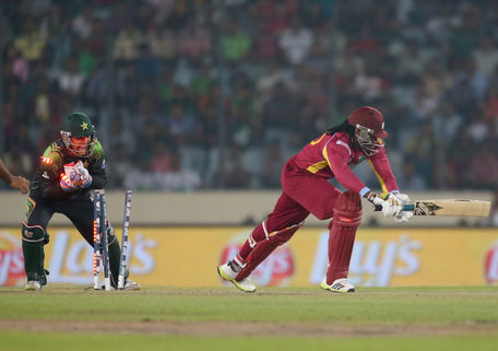 Chris Gayle is stumped by Kamran Akmal during the ICC World Twenty20 Bangladesh 2014 match between West Indies and Pakistan at Sher-e-Bangla Mirpur Stadium on April 1, 2014 in Dhaka, Bangladesh. (GETTY)