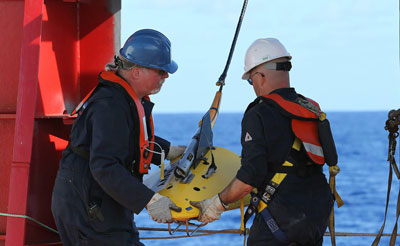 Phoenix Internaional personnel, Mike Unzicker and Chris Minor deploy the towed pinger locator off the deck of the Australian Defence Vessel Ocean Shield in the southern Indian Ocean during the search for the flight data recorder and cockpit voice recorder of the missing Malaysian Airlines flight MH370 in this picture released by the Australian Defence Force April 5, 2014. The search for missing Malaysia Airlines flight MH370 in remote seas off Australia headed underwater, with a U.S. Navy high tech "black box" locator deployed for the first time as the battery life of the cockpit data recorder dwindles. A total of 20 aircraft and ships were again scouring a massive area in the Indian Ocean some 2,000 km (1,200 miles) west of Perth, where investigators believe the Boeing 777 carrying 239 people came down. (Reuters)