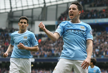 Manchester City's midfielder Samir Nasri (right) celebrates scoring their second goal during the English Premier League football match between Manchetser City and Southampton at the Etihad Stadium in Manchester, England, on April 5, 2014. (AFP)