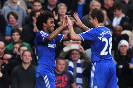 Chelsea's midfielder Willian (left) celebrates scoring their third goal with Chelsea's defender Cesar Azpilicueta during the English Premier League football match between Chelsea and Stoke City at Stamford Bridge In London on April 5, 2014. (AFP)