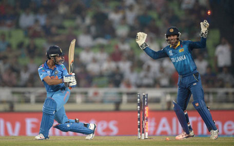 Kumar Sangakkara of Sri Lanka celebrates as Ajinkya Rahane of India is bowled by Angelo Mathews during the ICC World Twenty20 Bangladesh 2014 Final between India and Sri Lanka at Sher-e-Bangla Mirpur Stadium on April 6, 2014 in Dhaka, Bangladesh. (GETTY)