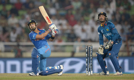 Virat Kohli of India hits out for six during the ICC World Twenty20 Bangladesh 2014 Final between India and Sri Lanka at Sher-e-Bangla Mirpur Stadium on April 6, 2014 in Dhaka, Bangladesh. (GETTY)