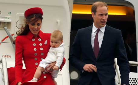 Britain's Prince William, his wife Catherine, Duchess of Cambridge and their son Prince George disembark from their plane after arriving in Wellington April 7, 2014. The Prince and his wife Kate are undertaking a 19-day official visit to New Zealand and Australia with their son George. (REUTERS)