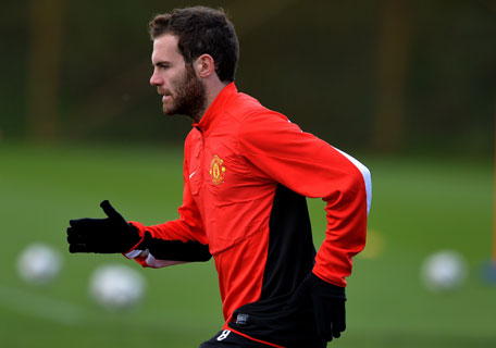 Manchester United's midfielder Juan Mata takes part in a training session at their Carrington training complex in Manchester, England, on April 8, 2014, on the eve of their UEFA Champions League second leg quarter-final football match against Bayern Munich in Germany. (AFP)