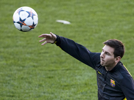 Barcelona's Lionel Messi takes part in a training session at the Vicente Calderon stadium in Madrid on April 8, 2014, on the eve of the UEFA Champions League quarter-final second leg football match Club Atletico de Madrid vs FC Barcelona. (AFP)