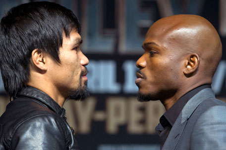 Boxer Manny Pacquiao (left) of the Philippines and undefeated WBO welterweight champion Timothy Bradley of the US face off during a news conference at the MGM Grand Hotel and Casino in Las Vegas, Nevada April 9, 2014. Pacquiao will challenge Bradley at the MGM Grand Garden Arena on April 12. (REUTERS)