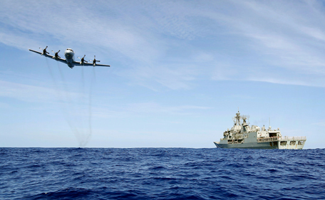 A Royal Australian Air Force (RAAF) AP-3C Orion conducts a low level fly-by before dropping supplies to Australian Navy ship HMAS Toowoomba as they continue to search for missing Malaysian Airlines flight MH370 in this picture released by the Australian Defence Force April 11, 2014. Search and rescue officials in Australia are confident they know the approximate position of the black box recorders from missing Malaysia Airlines Flight MH370, Australian Prime Minister Tony Abbott said on Friday. At the same time, however, the head of the agency coordinating the search said that the latest "ping" signal, which was captured by a listening device buoy on Thursday, was not related to the plane. (REUTERS)