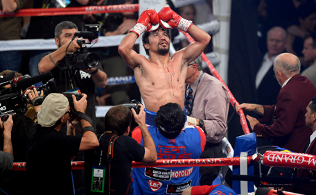 Manny Pacquiao celebrates his victory over Timothy Bradley (not pictured) after their WBO World Welterweight Title bout at MGM Grand Garden Arena. Pacquiao won via unanimous decision. Mandatory Credit: Joe Camporeale-USA TODAY Sports. (AFP)
