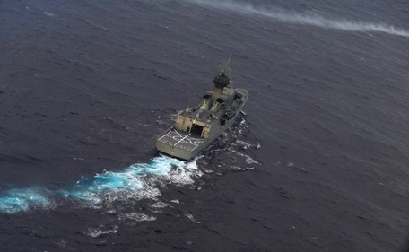 The Royal Australian Navy ship HMAS Perth is guided into position by a Royal New Zealand Airforce (RNZAF) P-3K2 Orion aircraft to recover an object in the southern Indian Ocean, as the search continues for missing Malaysian Airlines flight MH370 April 13, 2014. Australian officials leading the search for a missing Malaysia Airlines plane in the southern Indian Ocean are weighing when to deploy an underwater robot to aid in the hunt, now in its sixth fruitless week. MH370 disappeared soon after taking off on March 8 from Kuala Lumpur bound for Beijing with 227 passengers and 12 crew on board, triggering a multinational search that is now focused on the Indian Ocean. Picture taken April 13, 2014. (REUTERS)