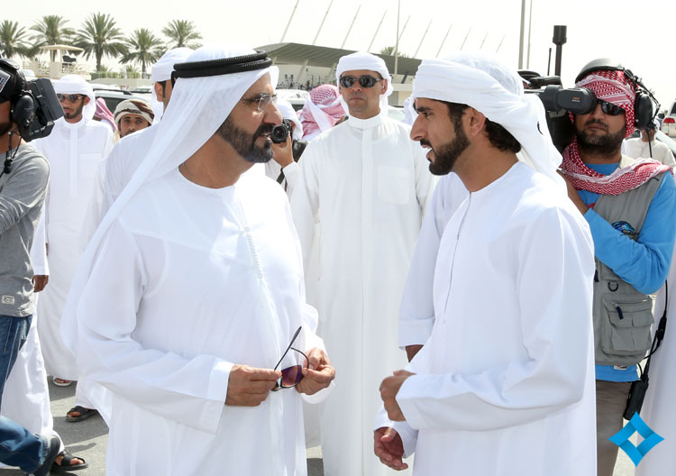 Mohammed bin Rashid talks with Hamdan bin Mohammed during the Camel Racing Festival