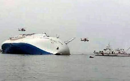 South Korea rescue helicopters fly over to rescue passengers from passenger ship Sewol in the water off the southern coast in South Korea. A government office says the South Korean ship carrying about 470 people have sent a distress call off the southern coast after it began tittering to one side. (AP)
