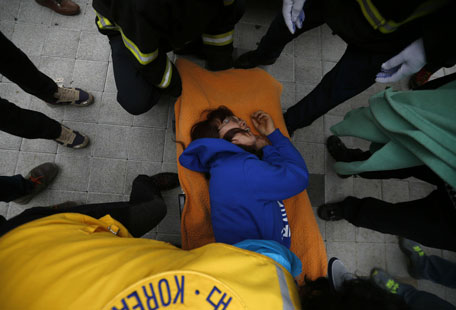 A family member of a missing passenger who was on the South Korean ferry "Sewol", which sank at sea, is wheeled into an ambulance after collapsing as she waits for news of their family from a rescue team at a gym in Jindo April 17, 2014. South Korean coastguard and navy divers resumed searching on Thursday for about 290 people still missing, many of them students from the same high school, after the ferry capsized in sight of land. (REUTERS)