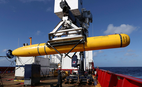 The Phoenix International Autonomous Underwater Vehicle (AUV) Artemis is craned over the side of Australian Defence Vessel Ocean Shield in the search for missing Malaysia Airlines Flight MH370 in the Southern Indian Ocean in his picture released by the Australian Defence Force on April 20, 2014. Australian officials supervising the search for missing Malaysia Airlines Flight MH370 told Reuters on Saturday that an underwater search for the black box recorder based on "pings" possibly from the device could be completed in five to seven days. (REUTERS)