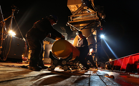 This handout photo taken on April 19, 2014 and received on April 20, 2014 from the Australain Defence Department shows the Phoenix Autonomous Underwater Vehicle (AUV) Artemis (C) being lowered onto the deck of Australian Defence vessel "Ocean Shield" after completing a mission in the search for the missing Malaysia Airlines Flight MH370 in the Indian Ocean. The effort to find missing flight MH370 is at a "very critical juncture", Malaysia's transport minister said on April 19 as authorities mull whether to reassess the challenging search of the Indian Ocean seabed that has so far found nothing. (AFP)