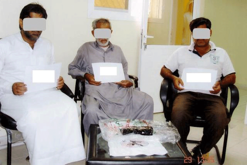 The three men who were nabbed with 1kg of opium in Al Ain city.