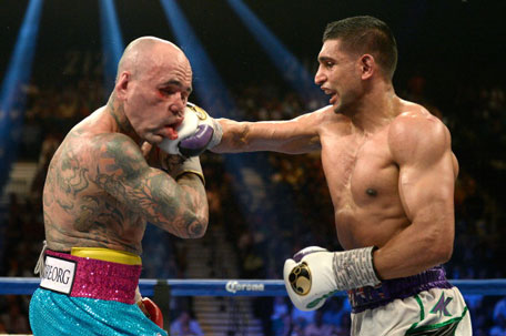 Amir Khan connects with a right at Luis Collazo during their welterweight bout at the MGM Grand Garden Arena on May 3, 2014 in Las Vegas, Nevada. (GETTY)