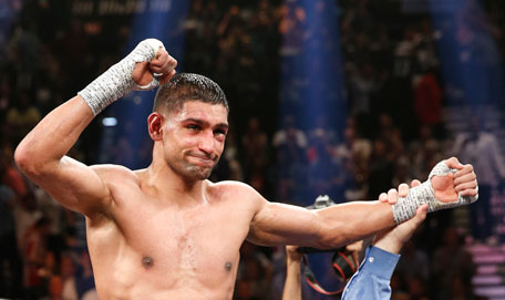 England's Amir Khan celebrates his unanimous decision over Luis Collazo in their silver welterweight title boxing fight Saturday, May 3, 2014, in Las Vegas. (AP)