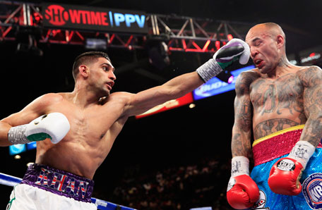 Amir Khan (left) of Britain punches Luis Collazo of the US during their welterweight fight at the MGM Grand Garden Arena in Las Vegas, Nevada, May 3, 2014. (REUTERS)