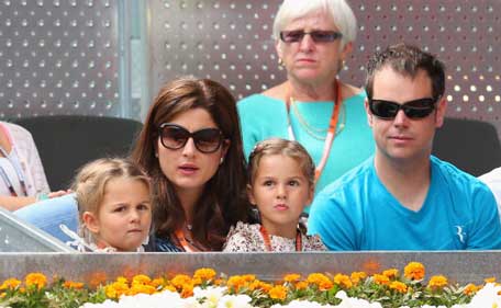 Myla Rose and Charlene Riva with mother Mirka Federer watch as Roger Federer of Switzerland plays Radek Stepanek of Czech Republic during day four of the Mutua Madrid Open tennis tournament at the Caja Magica on May 7, 2013 in Madrid, Spain. (GETTY)