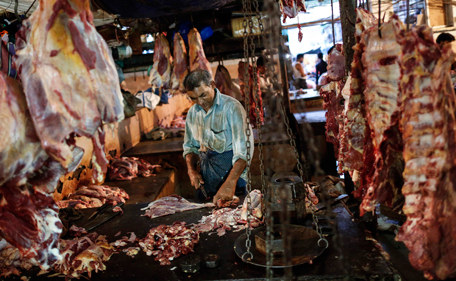 A butcher cuts up portions of beef for sale in an abattoir at a wholesale market in Mumbai May 11, 2014. India's main Hindu nationalist party Bharatiya Janata Party (BJP) says it plans to clamp down on beef exports if it takes power after general elections that end on Monday, threatening supplies from one of the world's biggest shippers of the meat. (REUTERS)