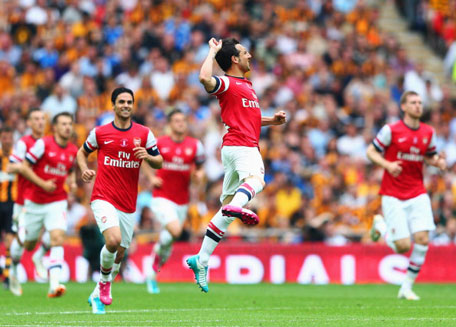 Arsenal's Santi Cazorla (centre) celebrates as he scores their first goal from a free kick during the FA Cup Final between Arsenal and Hull City at Wembley Stadium on May 17, 2014 in London, England. (GETTY)