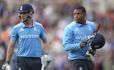 England's Jos Buttler (left) and Chris Jordan leave the field after the completion of England's innings during their one-day international cricket match against Sri Lanka at the Oval cricket ground in London May 22, 2014. (REUTERS)