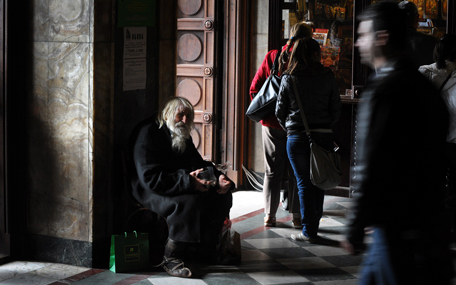 The 100-year-old Dobri Dobrev, known as "Grandpa" Dobri, begs for alms in the porch of the golden-doomed Alexander Nevski cathedral, in the center of Sofia, on April 20, 2014. In a country ravaged by poverty and corruption, a centenarian beggar is celebrated as a saint: the ascetic "Grandpa" Dobri has spent over twenty years begging for the Church. AFP