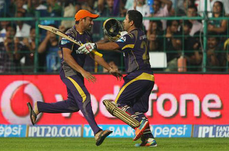 Piyush Chawla (left) is congratulated by his ecstatic team mate Robin Uthappa after hitting the winning runs for Kolkata Knight Riders in the IPL 7 final against Kings XI Punjab at M Chinnaswamy Stadium in Bengaluru on Sunday June 1, 2014. (TWITTER)