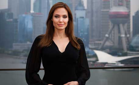 US actress Angelina Jolie poses on the terrace of a hotel in Shanghai during a press event on June 3, 2014. Jolie said that she was thrilled her latest film "Maleficent," a modern retelling of the life of Sleeping Beauty's arch-nemesis, had debuted at the top of the box office. (AFP)