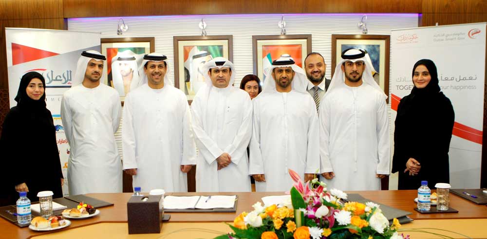 Ahmad bin Humaidan, Director-General of DSG, and Sami Dhaen Al Qamzi, Deputy Chairman and Managing Director of DMI, and other DSG and DMI officials after signing the agreement in Dubai on Monday. (Picture courtesy 'Al Bayan' newspaper)