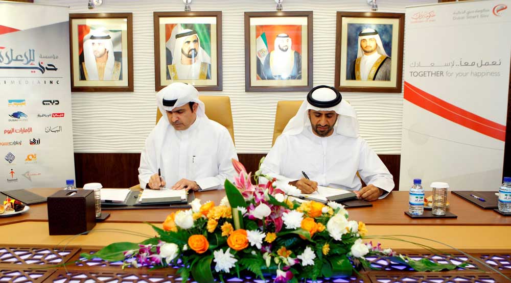 Ahmad bin Humaidan, Director-General of DSG, and Sami Dhaen Al Qamzi, Deputy Chairman and Managing Director of DMI, signing the agreement in Dubai on Monday. (picture courtesy 'Al Bayan' newspaper)