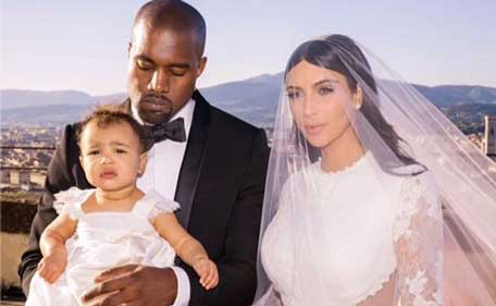 Reality star Kim Kardashian shared this wedding snapshot featuring husband Kanye West and baby North West. (Instagram)