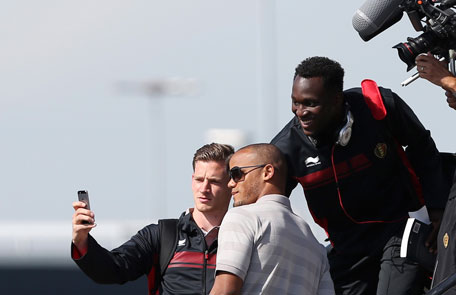 Belgium's national soccer team players Jan Vertonghen, Vincent Kompany and Romelu Lukaku pose for a photograph before boarding a plane bound for 2014 World Cup in Brazil at Brussels international airport June 10, 2014. (REUTERS)