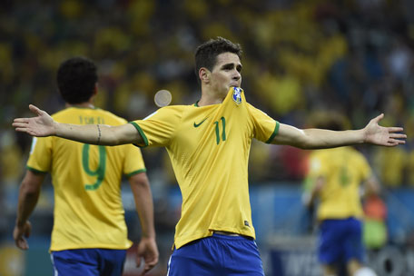Brazil's midfielder Oscar celebrates after scoring a goal during a Group A football match between Brazil and Croatia at the Corinthians Arena in Sao Paulo during the 2014 FIFA World Cup on June 12, 2014.  (AFP)