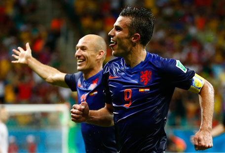 Robin van Persie of the Netherlands (front) celebrates with teammate Arjen Robben after scoring the team's fourth goal against Spain during their 2014 World Cup Group B soccer match at the Fonte Nova arena in Salvador June 13, 2014. (REUTERS)