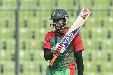 Bangladeshi cricketer Shakib Al Hasan reacts after scoring a half-century during the One Day International between India and Bangladesh at the Sher-e-Bangla National Cricket Stadium in Dhaka on June 15, 2014. (AFP)